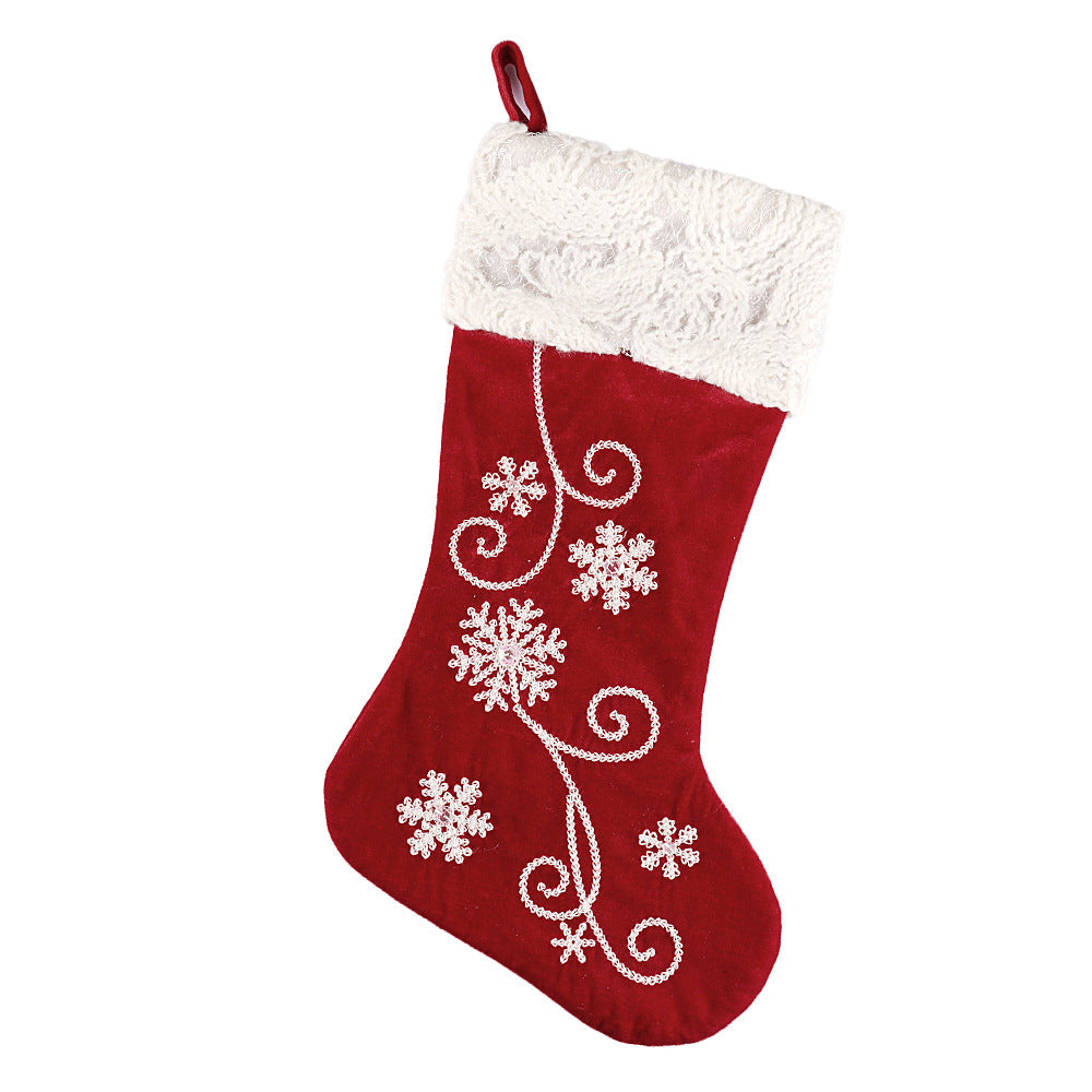Christmas decorations pendant socks in festive holiday designs, displayed for hanging