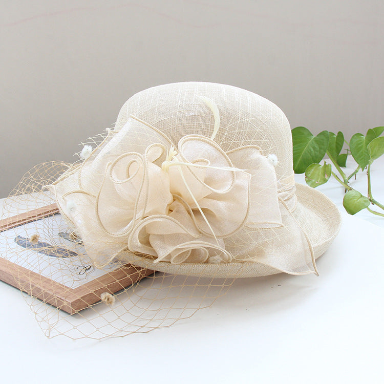 Banquet flower top hat with curled brim, decorative floral detail, and sun hat design