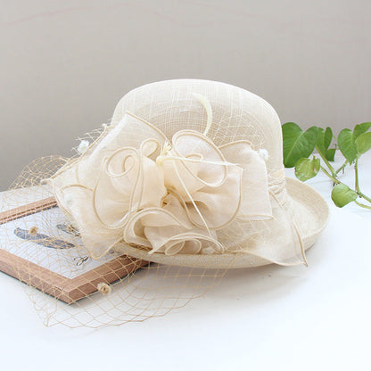 Banquet flower top hat with curled brim, decorative floral detail, and sun hat design