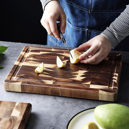 Solid wood parquet cutting board for kitchen household use, featuring a decorative wood-grain pattern