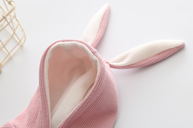 Small dog knitted sweater with rabbit ears costume in soft pink fabric