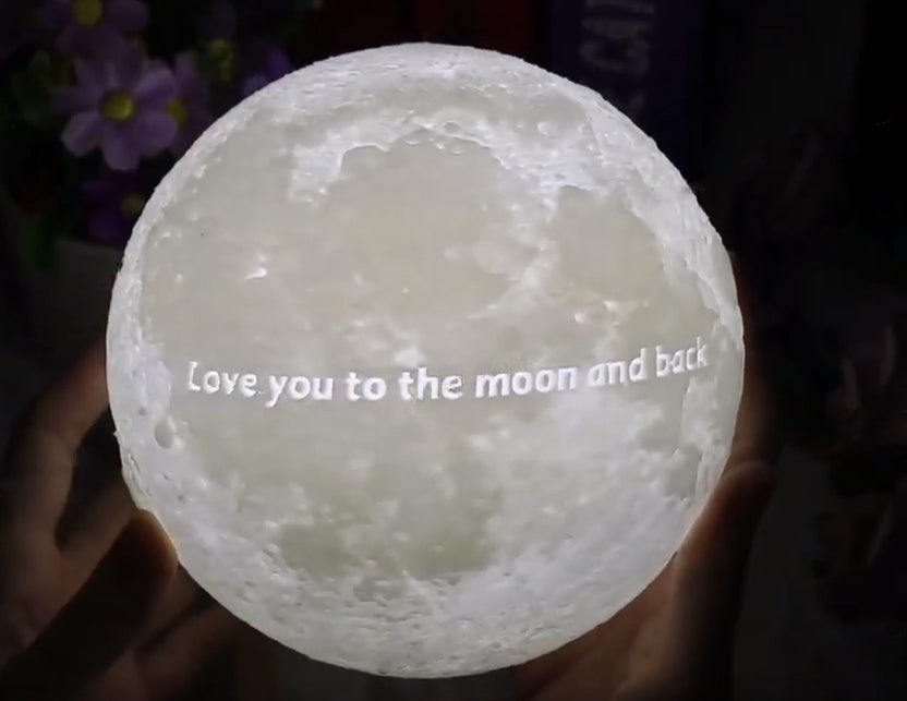 Custom moon lamp with detailed lunar surface texture, illuminated in soft light, showing a round moon-shaped design