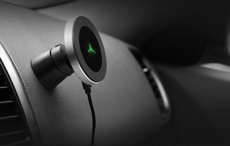 Car magnetic wireless charger by My Store mounted in a vehicle interior with phone charging wirelessly