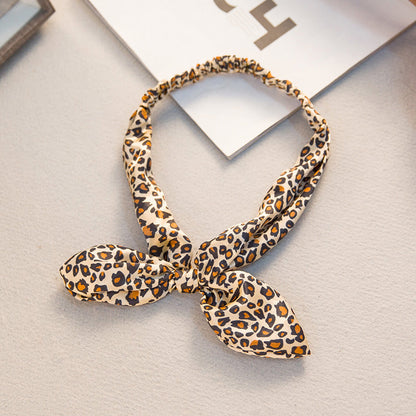 Big bow tie bunny ears headband with playful rabbit ears and oversized bow detail