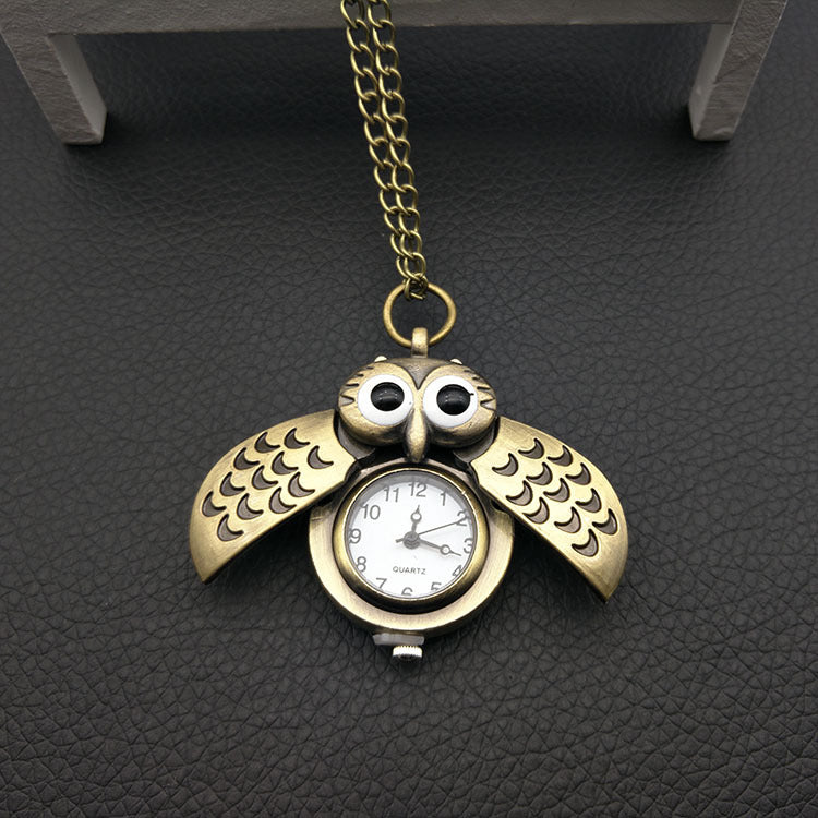 Owl pocket watch with detailed owl design on the case