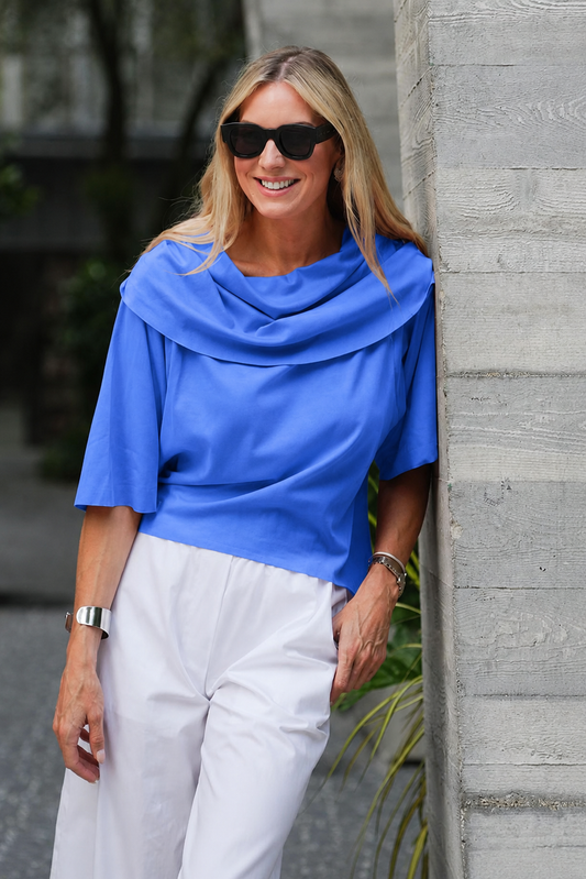 Model wearing a Pima cotton Jackie O T-shirt in cornflower blue by PLANET by Lauren G, showcasing its soft fabric and classic fit.