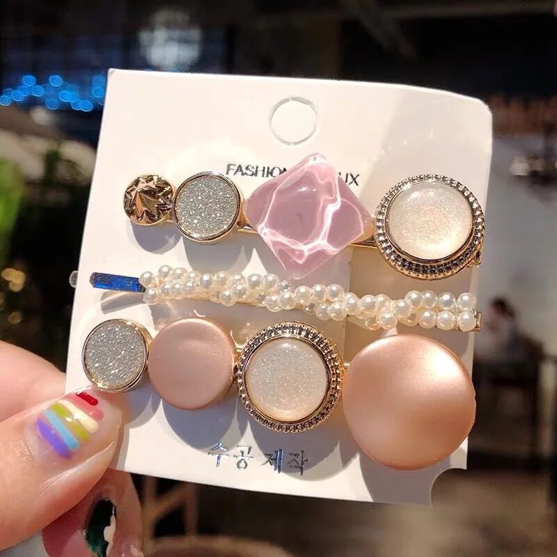 Pearl hair accessories set displayed on a clean background