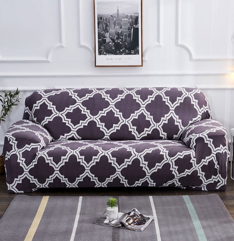 Elastic universal sofa cover in a neutral color, fitted over a standard sofa with stretchable fabric and elastic edges