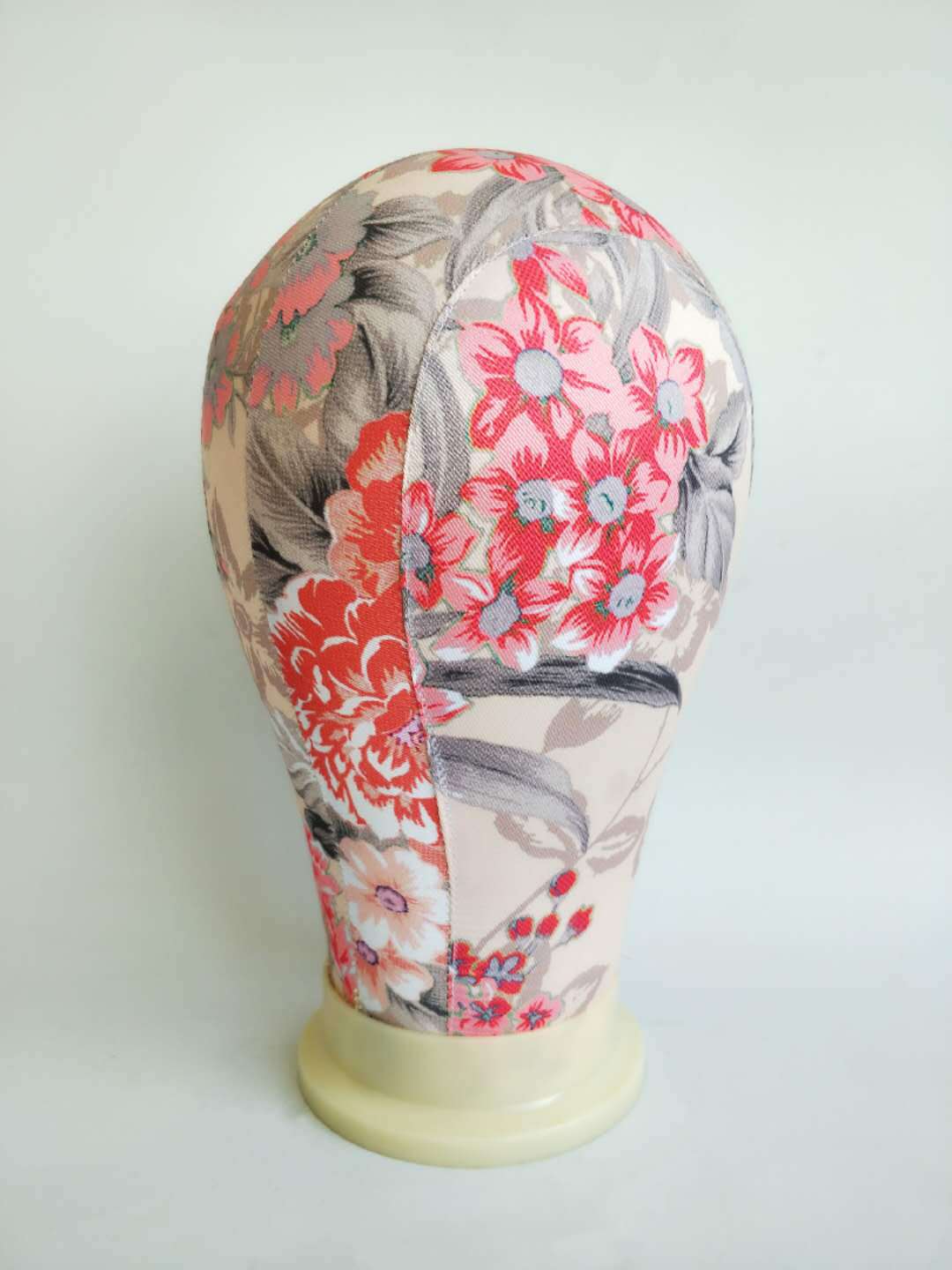 Canvas head mold for finishing wig shape, displayed for wig styling and shaping setup