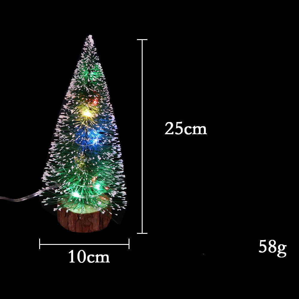 Mini Christmas tree with glowing LED lights and festive Christmas decorations