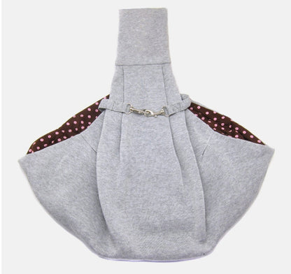 Foldable pet shoulder bag for carrying small pets, shown in a compact portable design