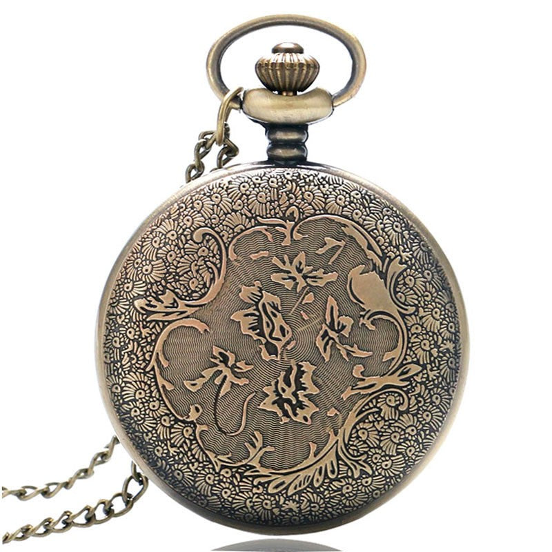 Classic pocket watch with polished metal case and visible clock face