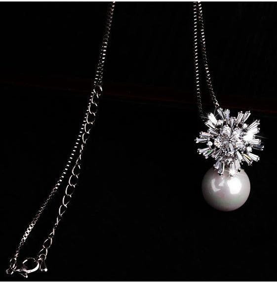 Pearl zircon necklace featuring a delicate design with lustrous pearl and sparkling zircon accents