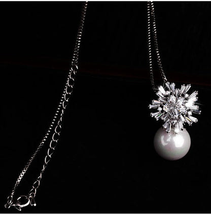 Pearl zircon necklace featuring a delicate design with lustrous pearl and sparkling zircon accents