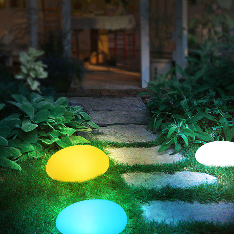 Solar light stone LED grass lamp with textured stone finish and integrated solar panel for outdoor lighting
