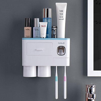 Non-marking hanging magnetic toothbrush holder with single drawer, toothpaste squeezer, and toiletry storage rack