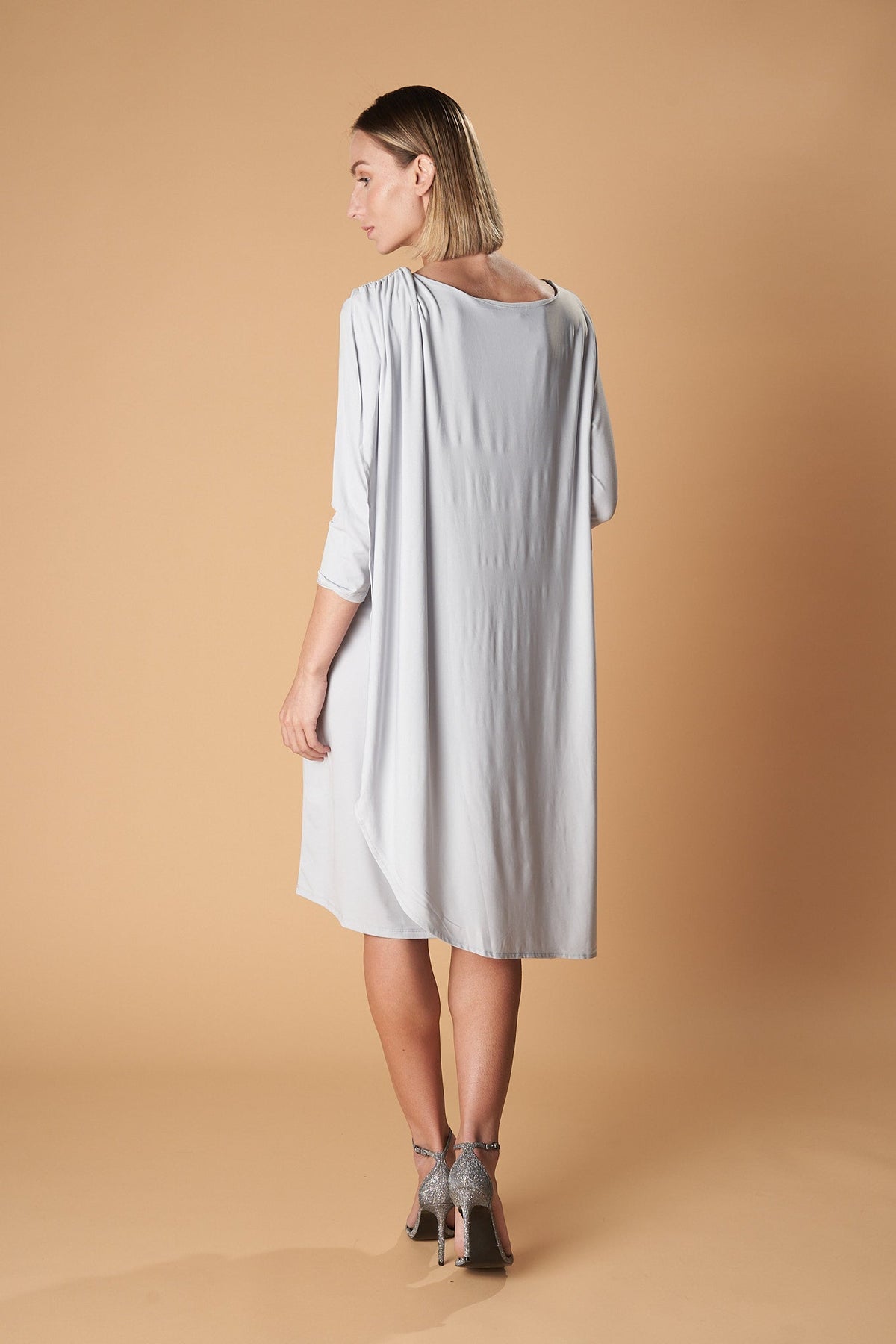 Ceylan Bcn Lady Multidress, stylish and versatile dress shown on a hanger with colorful fabric details.