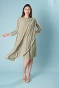 Ceylan Bcn lady multiway dress displayed on a hanger with colorful patterns and flowing fabric.