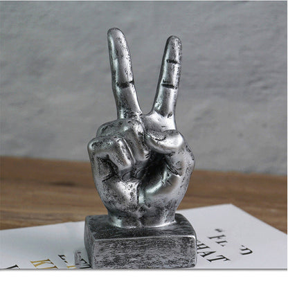 Resin gesture ornaments in assorted hand gesture designs geschniegelt