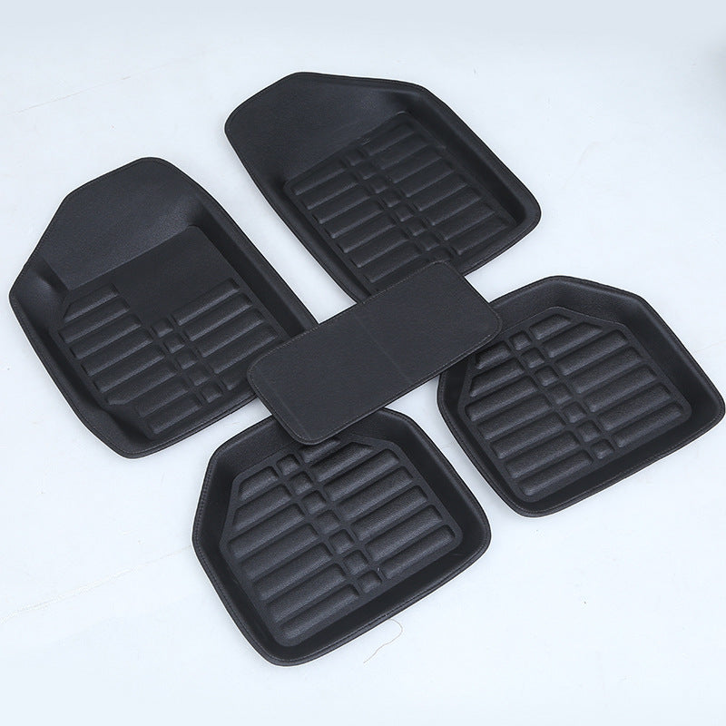 Black car mat by My Store, textured surface and fitted edges shown from above
