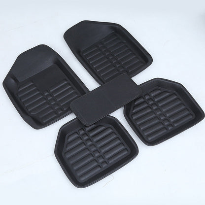 Black car mat by My Store, textured surface and fitted edges shown from above