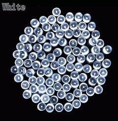 LED solar string lights for Christmas garden decoration, featuring warm white lights on green wire
