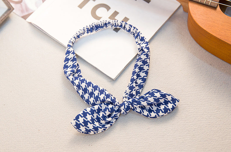 Big bow tie bunny ears headband with floppy ears and oversized bow detail