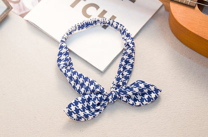 Big bow tie bunny ears headband with floppy ears and oversized bow detail