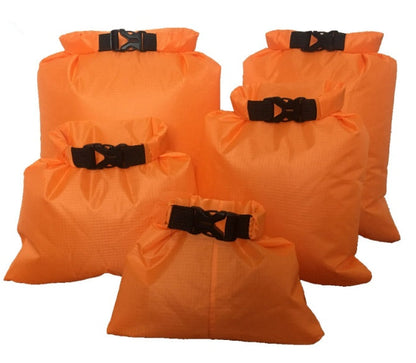 Waterproof dry bags in assorted sizes and colors for keeping gear dry