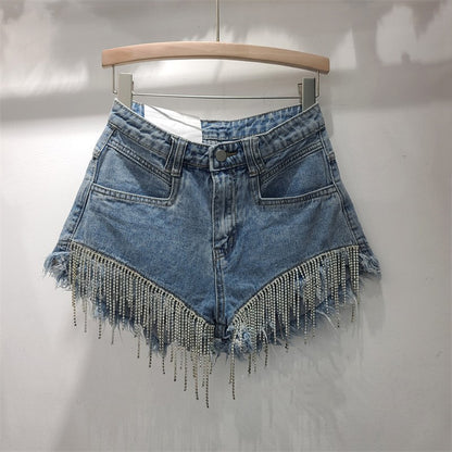 High-waisted ripped denim shorts for women in a 2023 summer style, featuring distressed details and a casual fit.