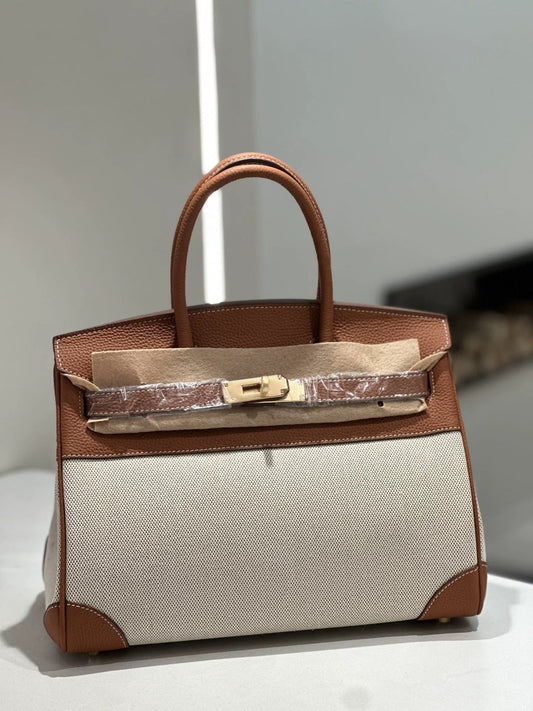 Genuine leather Birkin-style cowhide tote handbag with fabric lining and structured Kelly-style design
