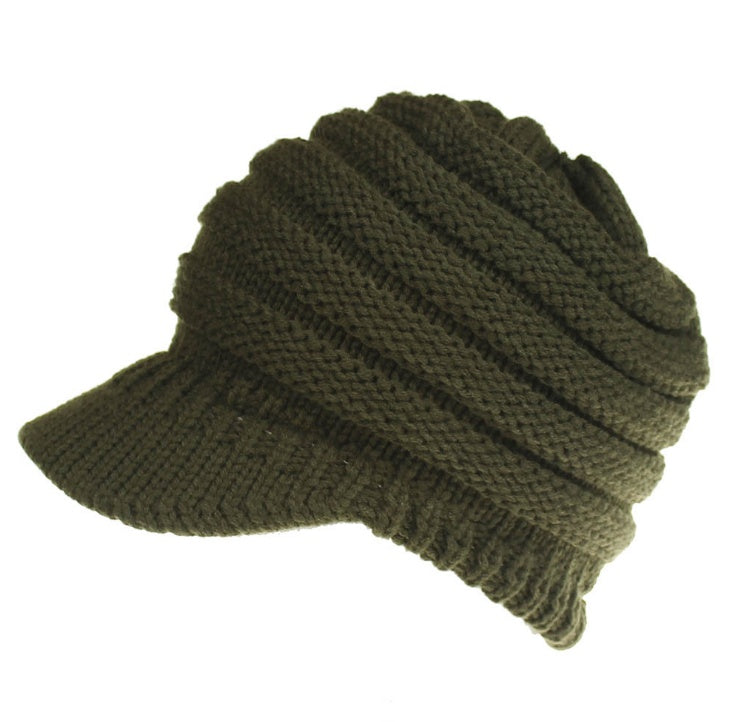 Women’s ponytail beanie, soft knitted autumn winter hat with warm skullcap design, shown in a neutral color