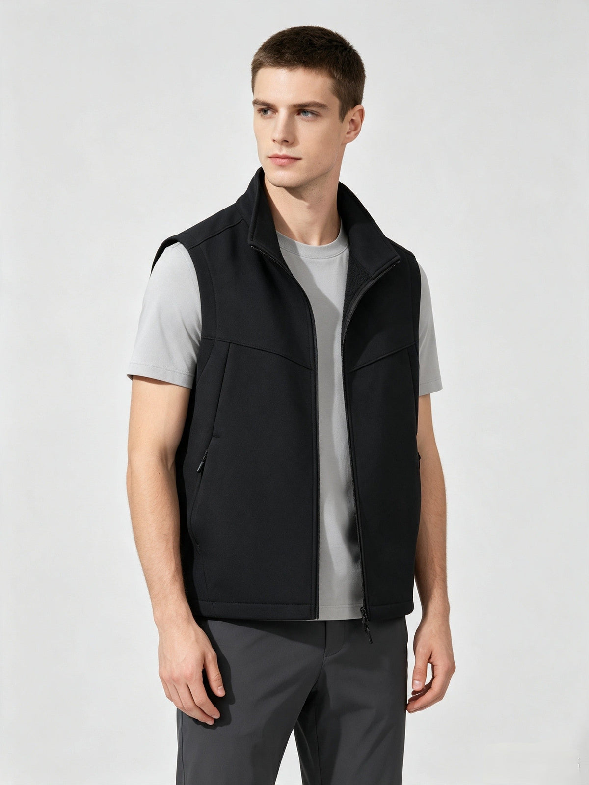Men and women softshell vest with stand collar, zip front, fleece lining, and sleeveless windproof outdoor design