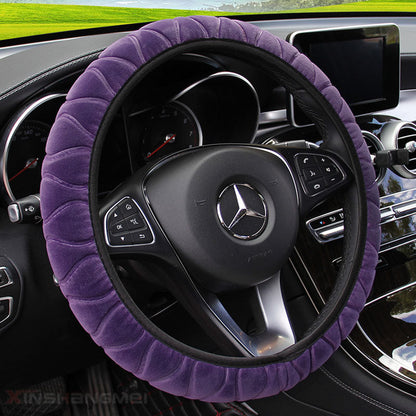 Plush car steering wheel cover in soft fabric, showing a cozy textured design around the wheel
