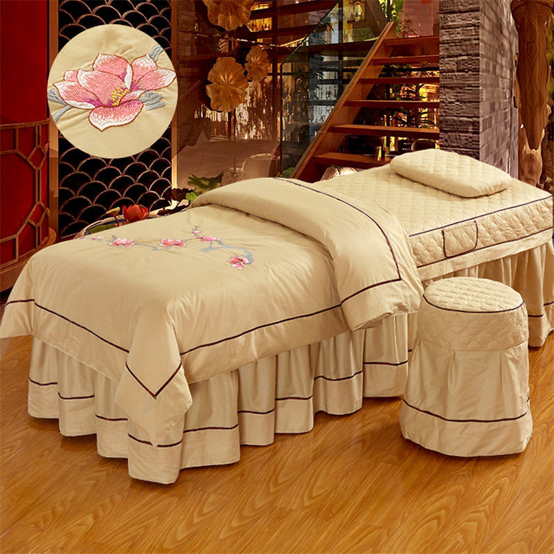 Beauty bed salon bed cover in white, fitted over a professional treatment bed