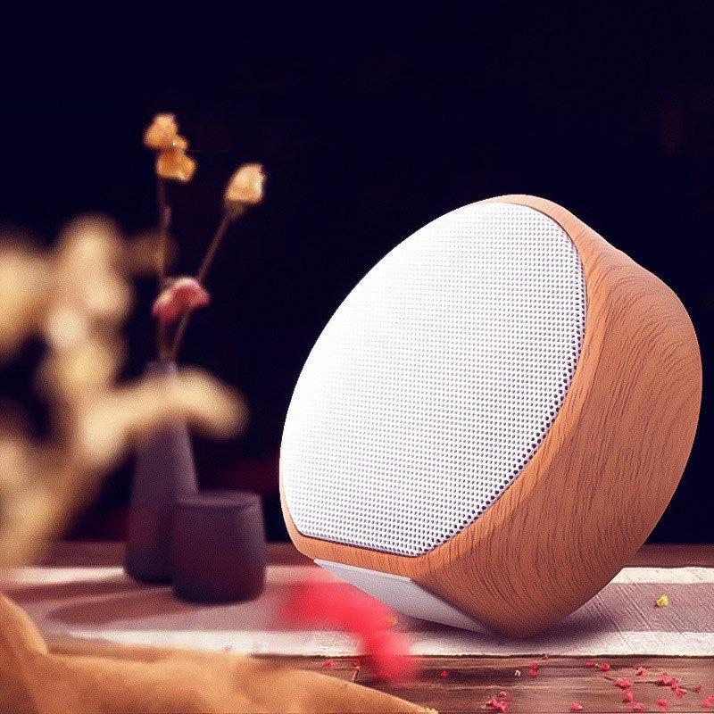 Wood grain Bluetooth speaker by My Store with a natural wood finish and compact design