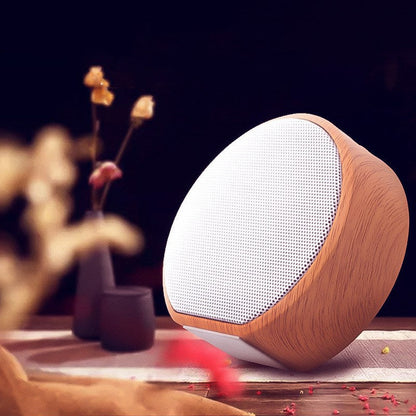 Wood grain Bluetooth speaker by My Store with a natural wood finish and compact design