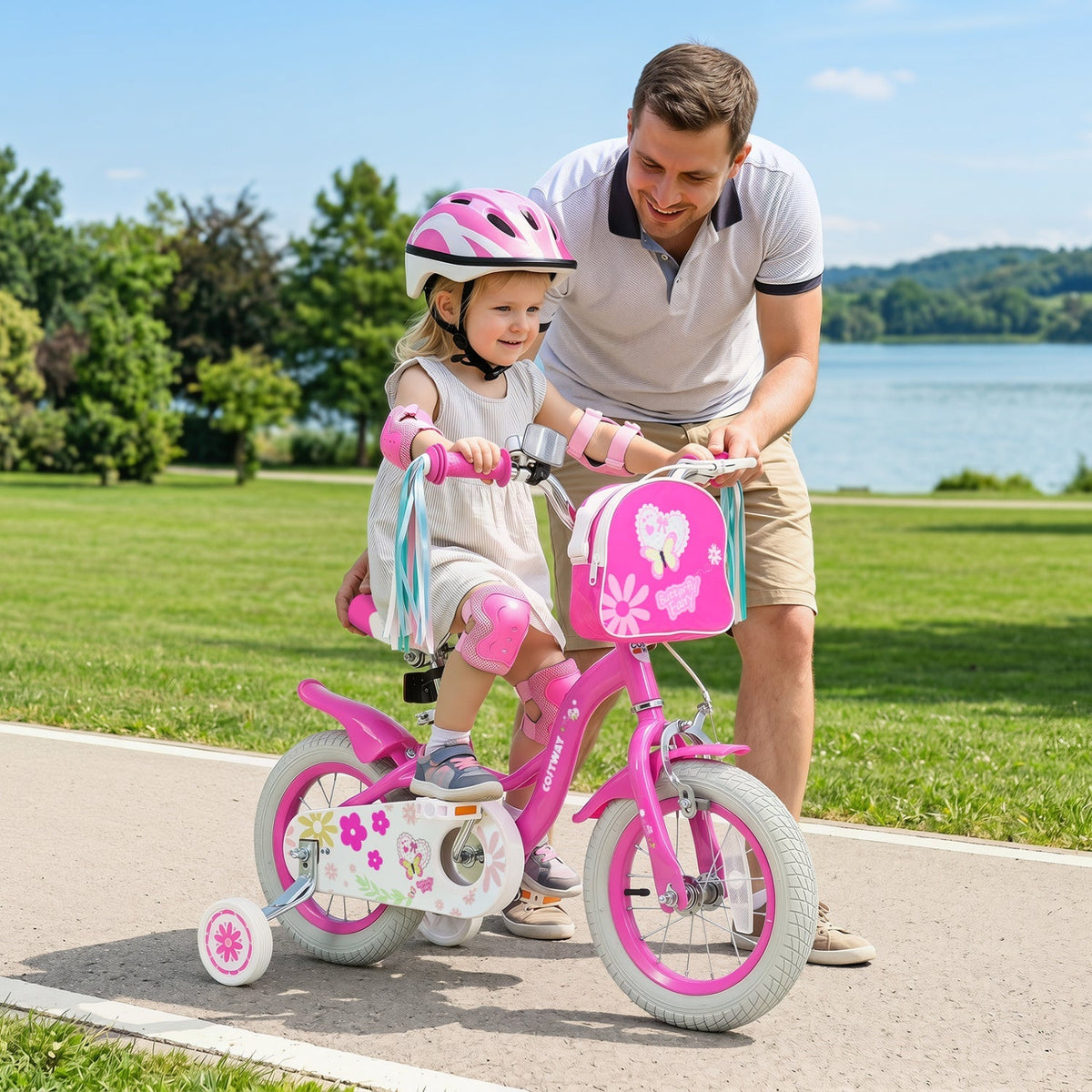 Girls bike for ages 12-18 inches with training wheels, front bag, pink frame, and colorful accents for kids' outdoor riding.