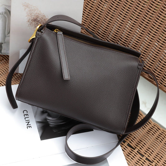 Top-grain leather messenger bag with shoulder strap, crossbody design, and commuter styling
