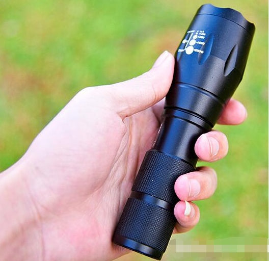 Outdoor flashlight with durable black housing and bright LED beam for camping, hiking, and emergency use