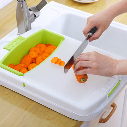 Kitchen drain cutting board with integrated colander-style drainage area in a compact rectangular design