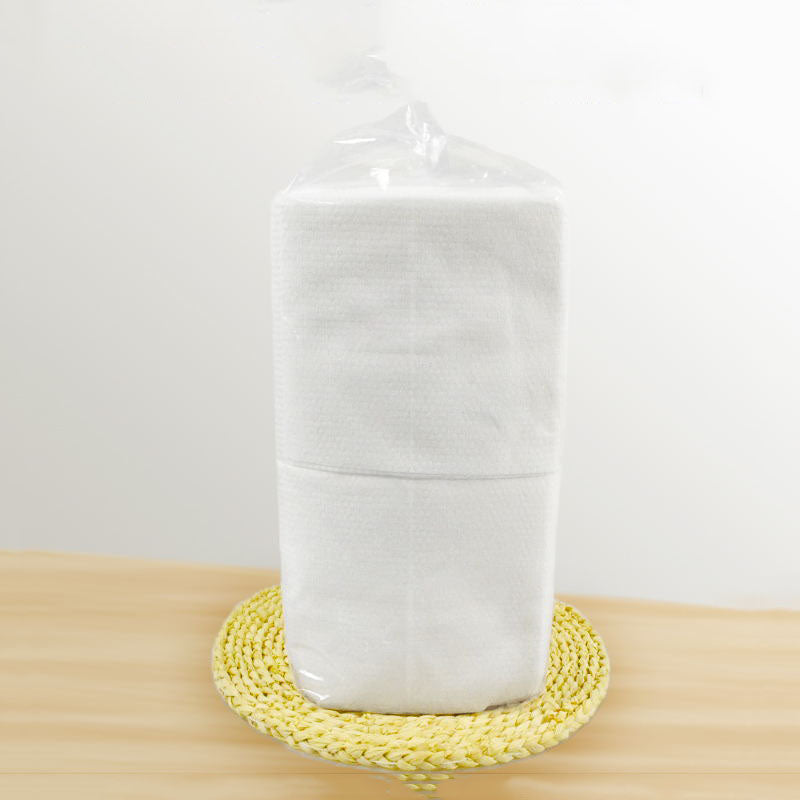 Disposable bath towels, soft white single-use towels folded neatly for bathroom or travel use