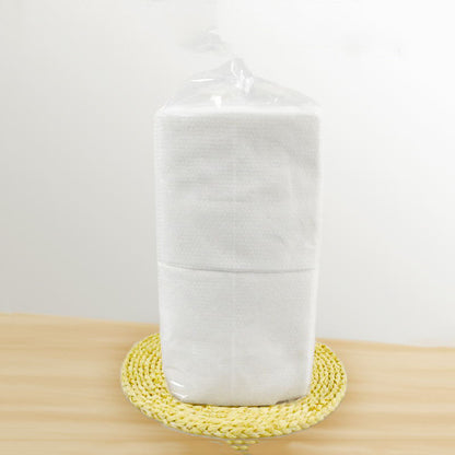 Disposable bath towels, soft white single-use towels folded neatly for bathroom or travel use