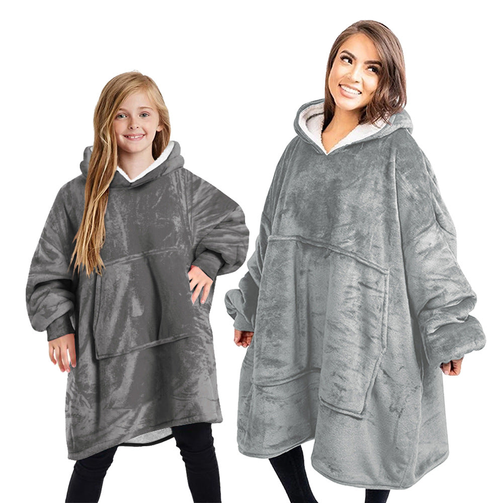 Warm cashmere blanket in a soft, neutral tone with a smooth, cozy texture