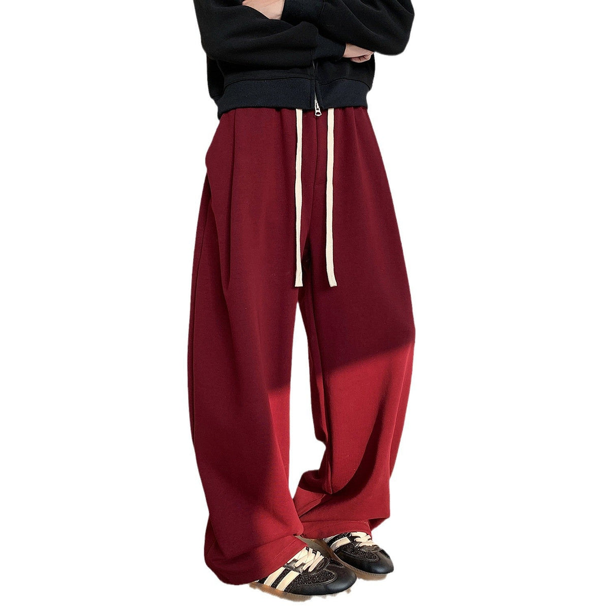 Plus size fleece-lined heavy loose track pants in a relaxed fit, shown in a neutral color