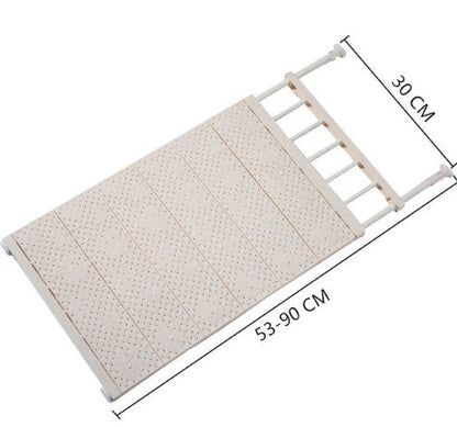 Space-saving adjustable wall-mounted kitchen storage rack in white with multiple shelves