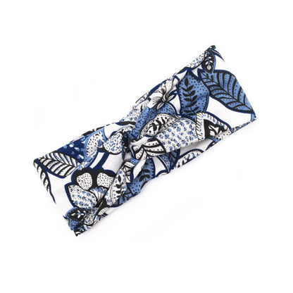Floral cross hair band with a delicate flower design 񟿿