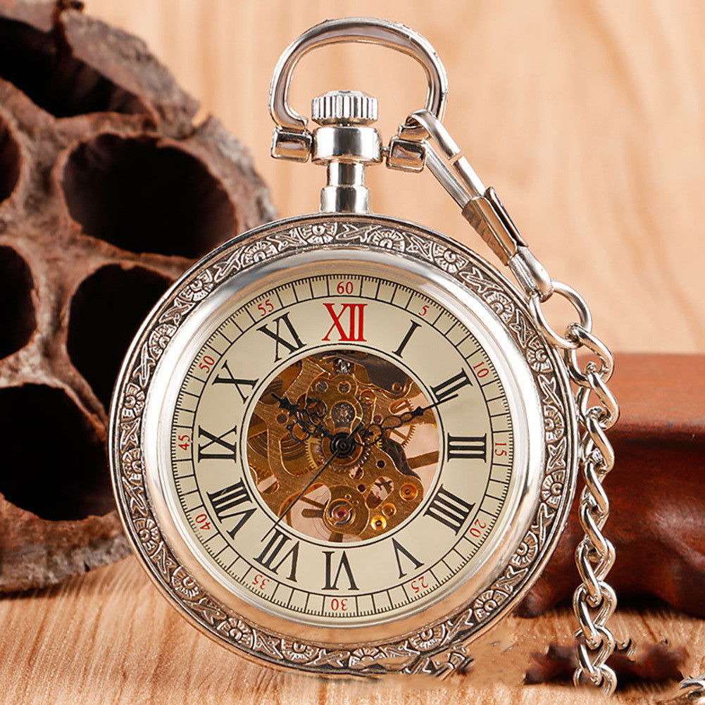Carved mechanical pocket watch with ornate engraved case, displayed open to reveal visible gears and dial