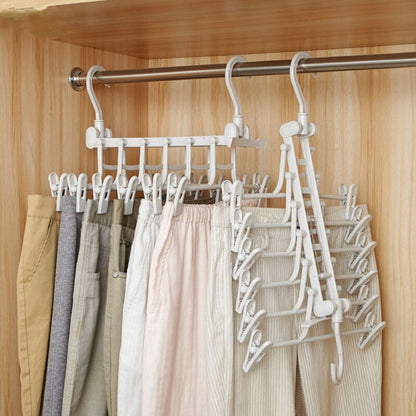 Space Saver Magic hanging clothes hanger rack with multiple slots for organizing garments vertically