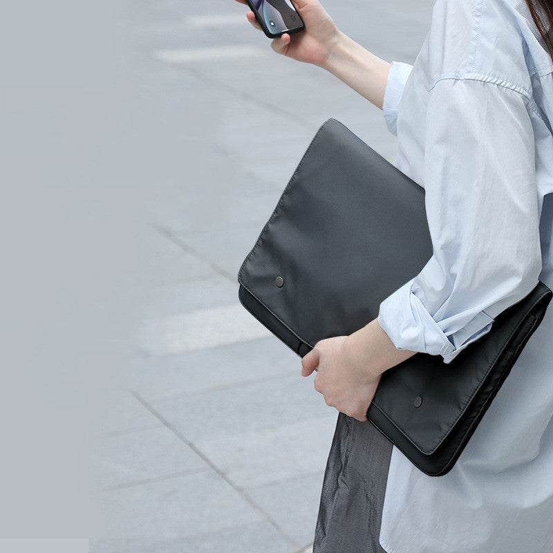 Black and white laptop bag protective cover viewed from the front